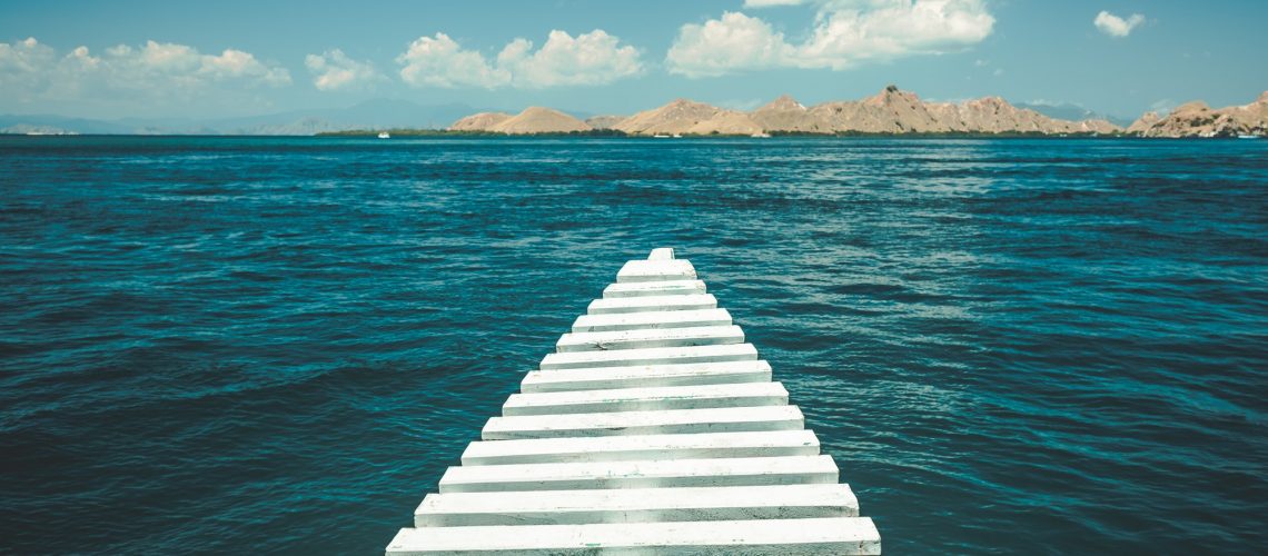 Close-up pier leading to the ocean. Komodo island